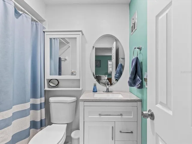 an aerial view of residential houses with city view