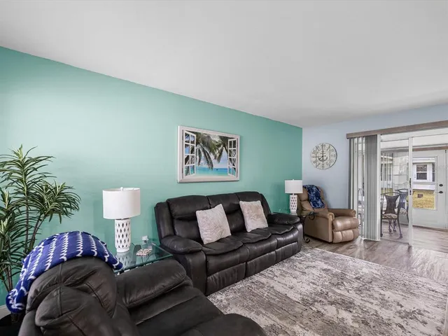 a large kitchen with a table and chairs