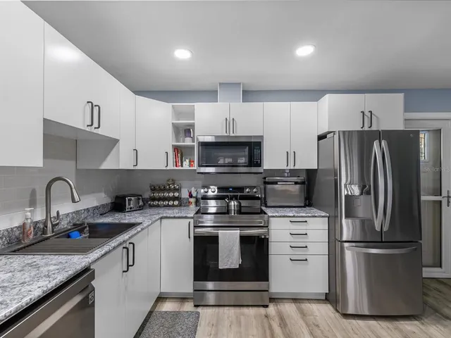 a bathroom with a shower curtain and a window