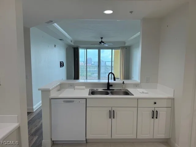 a kitchen with a sink and a window