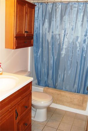 35 Lynbrook Road Methuen, MA 01844 - Photo 7 of 8 a bathroom with a toilet and a shower curtain