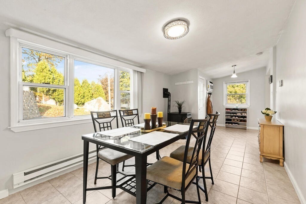 23 Appleton Street Saugus, MA 01906 - Photo 11 of 30 a view of a dining room with furniture and a window