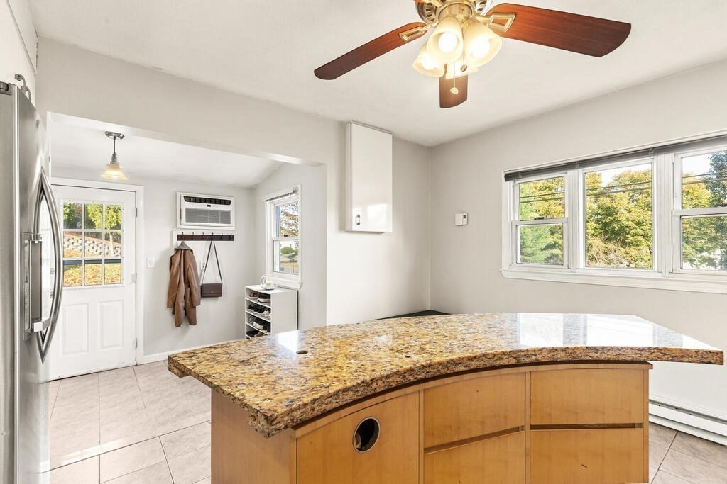 23 Appleton Street Saugus, MA 01906 - Photo 15 of 30 a bathroom with a granite countertop sink and a mirror