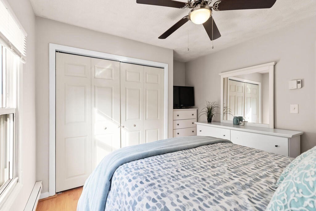 23 Appleton Street Saugus, MA 01906 - Photo 18 of 30 a bedroom with a bed and a flat tv screen on dresser