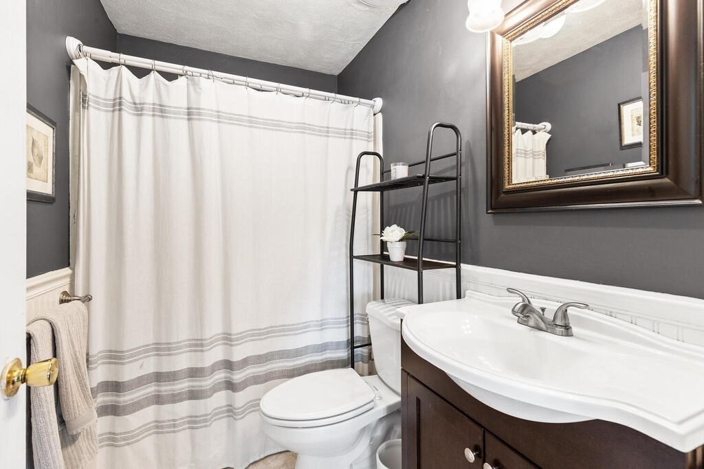 23 Appleton Street Saugus, MA 01906 - Photo 23 of 30 a bathroom with a sink toilet and shower