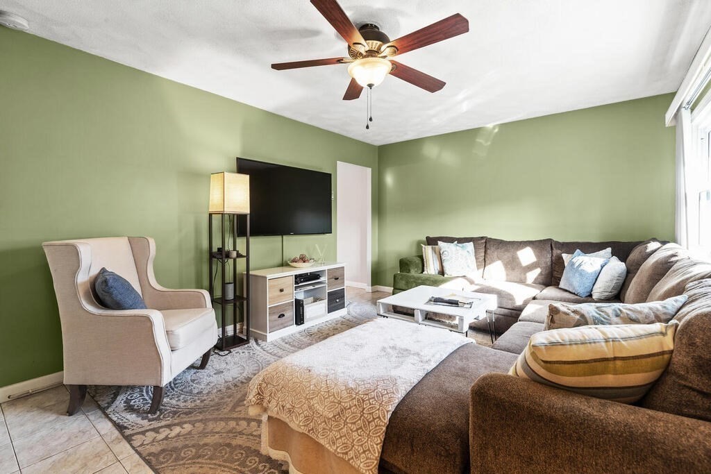 23 Appleton Street Saugus, MA 01906 - Photo 5 of 30 a spacious bedroom with a bed and a flat screen tv