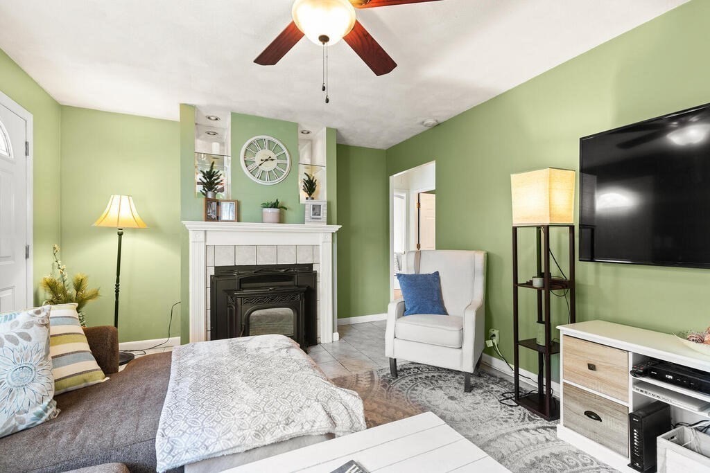 23 Appleton Street Saugus, MA 01906 - Photo 8 of 30 a living room with furniture and a fireplace