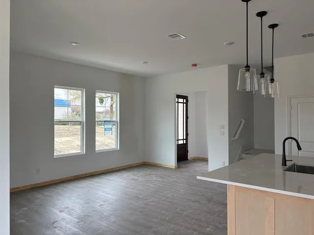 a view of a room that has a sink and a window