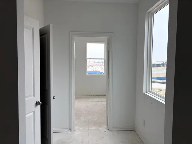 a view of an empty room and window