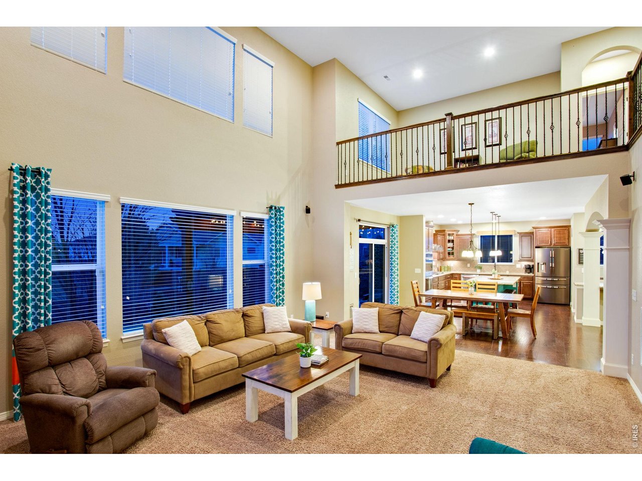 5728 Connor Street Timnath, CO 80547 - Photo 16 of 50 a living room with furniture and a ceiling fan