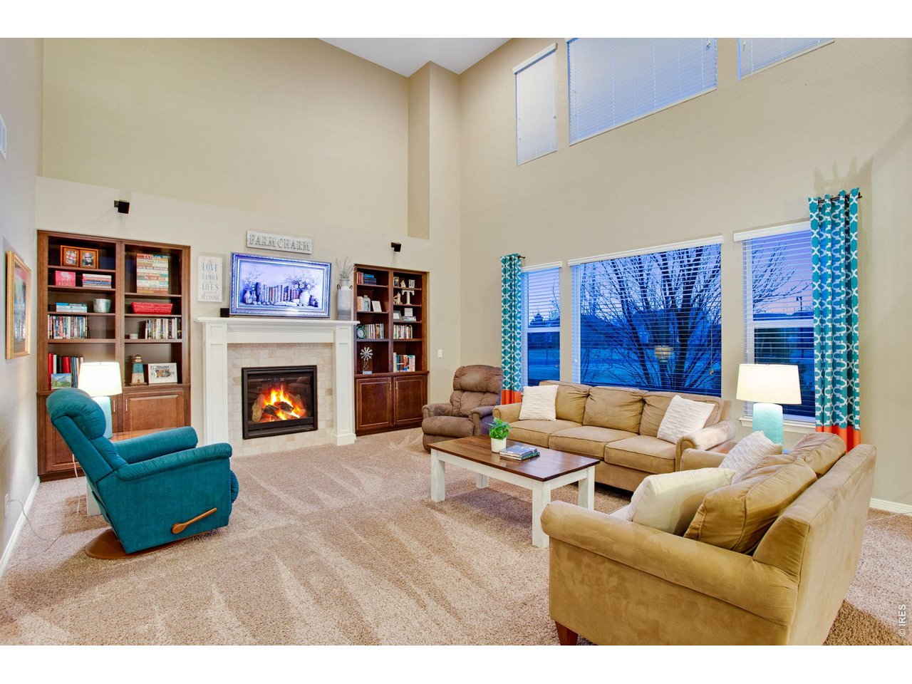 5728 Connor Street Timnath, CO 80547 - Photo 18 of 50 a living room with furniture and a fireplace