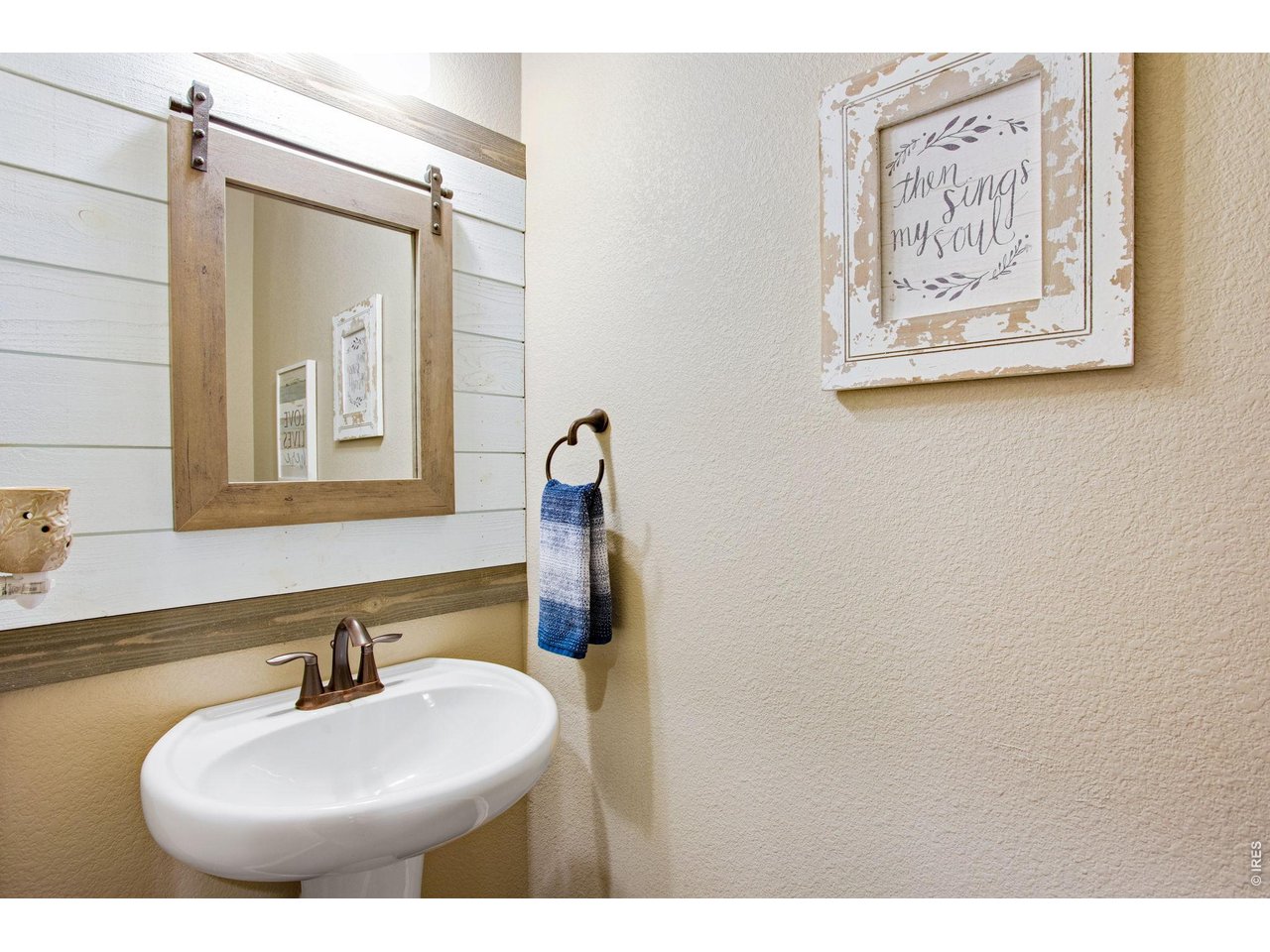 5728 Connor Street Timnath, CO 80547 - Photo 19 of 50 a bathroom with a sink and a mirror
