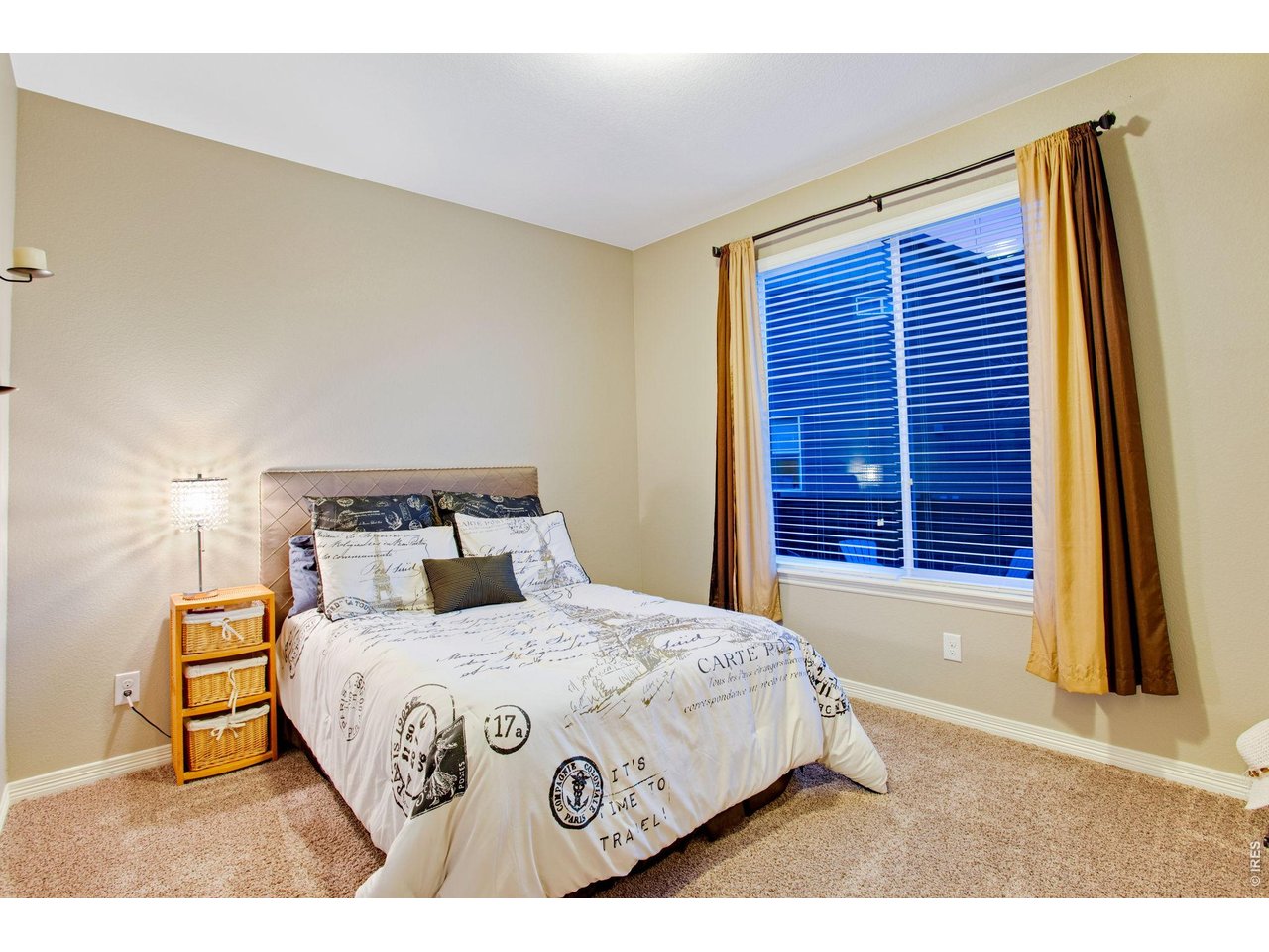5728 Connor Street Timnath, CO 80547 - Photo 26 of 50 a bedroom with a bed and a night stand