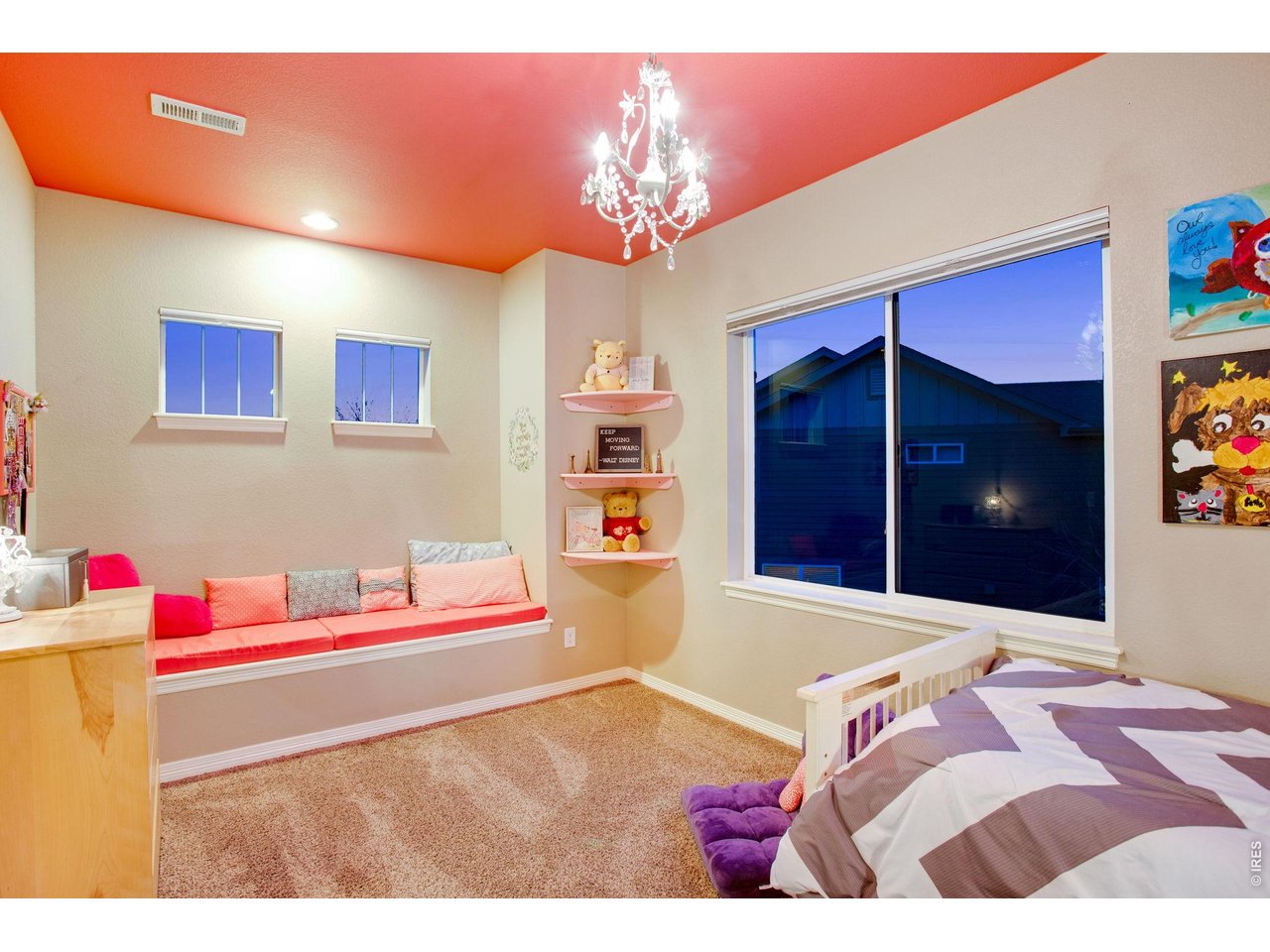 5728 Connor Street Timnath, CO 80547 - Photo 29 of 50 a bedroom with a bed and a chandelier