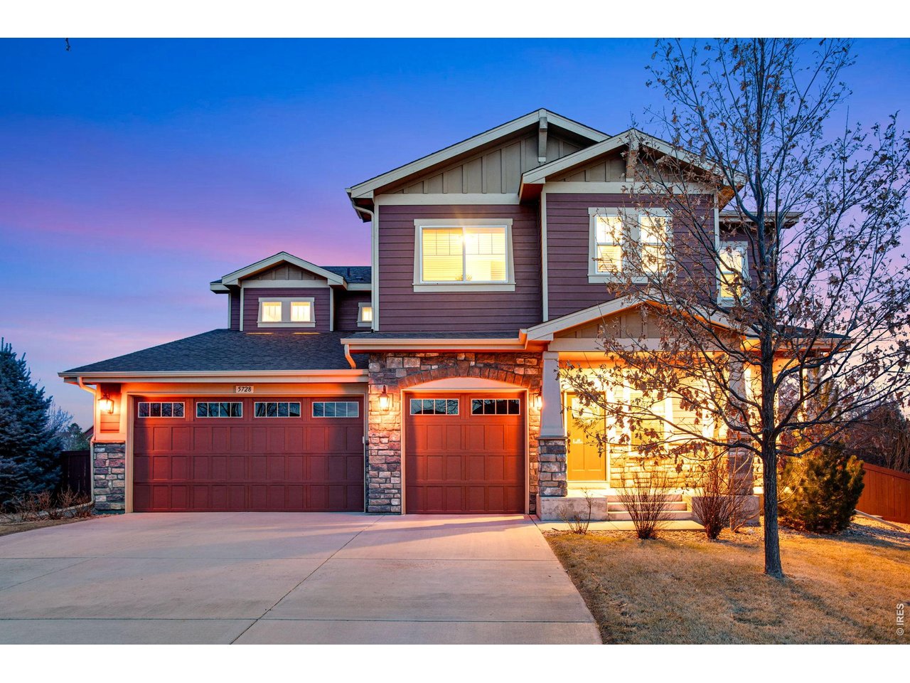 5728 Connor Street Timnath, CO 80547 - Photo 3 of 50 a front view of a house with a yard