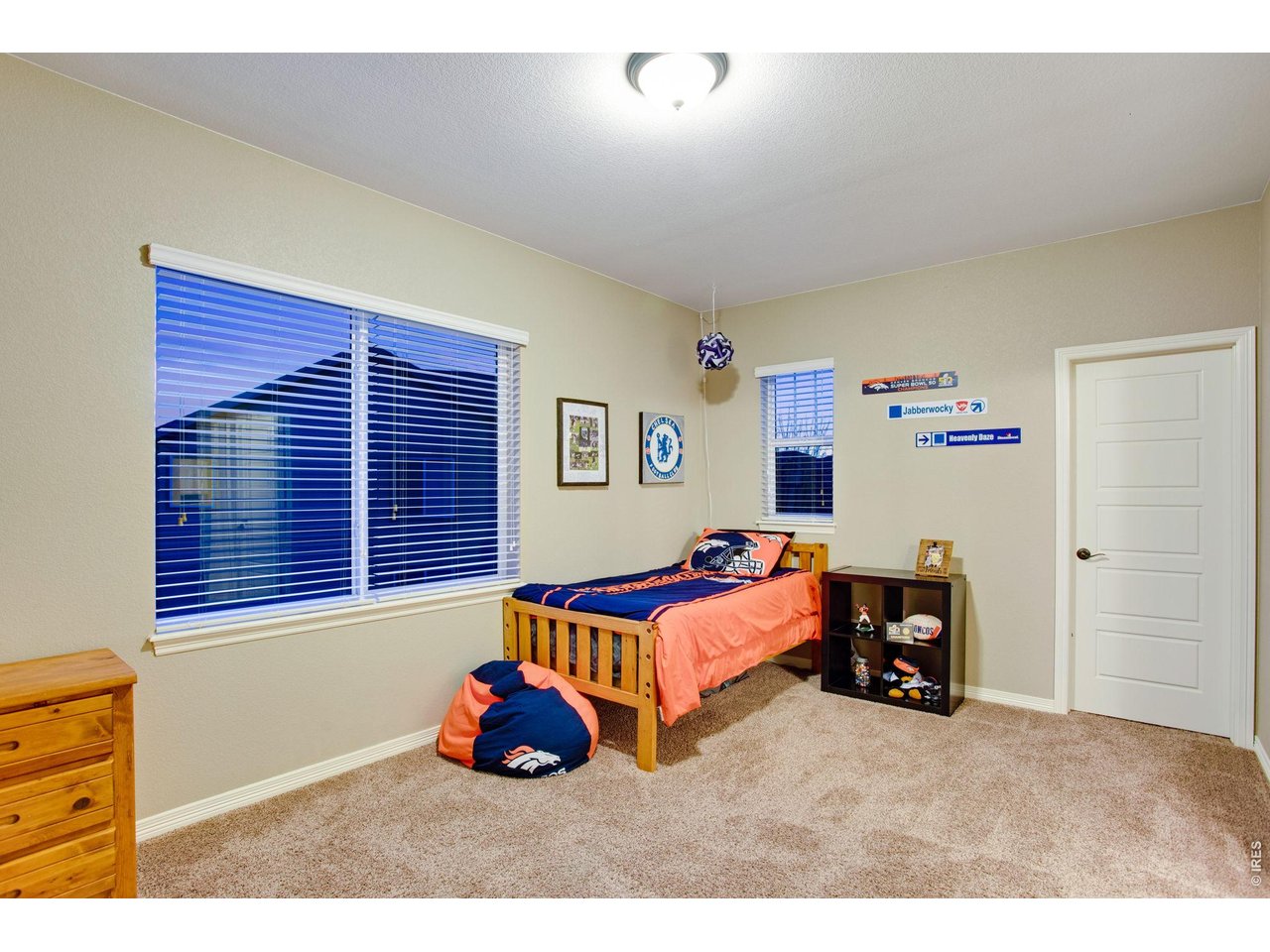 5728 Connor Street Timnath, CO 80547 - Photo 30 of 50 a bedroom with furniture and a window