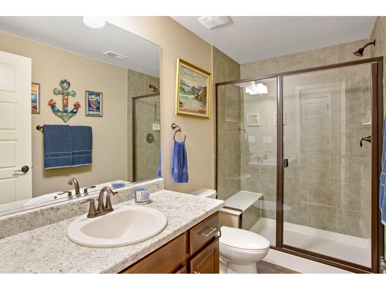 5728 Connor Street Timnath, CO 80547 - Photo 34 of 50 a bathroom with a sink toilet and shower