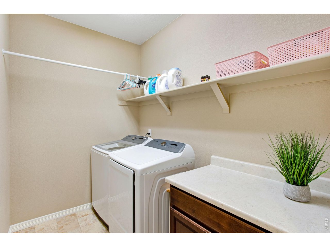 5728 Connor Street Timnath, CO 80547 - Photo 36 of 50 a utility room with dryer and washer