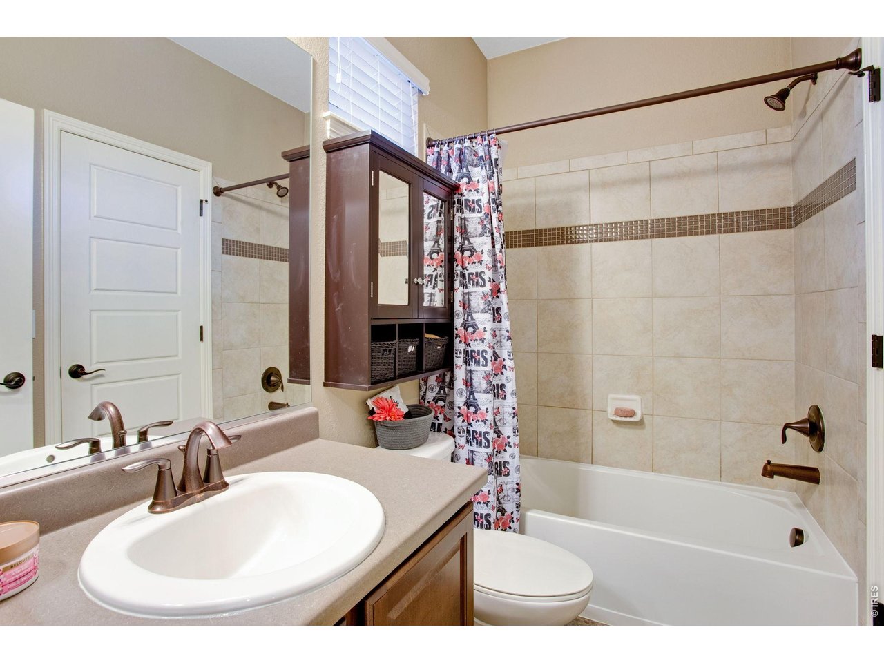 5728 Connor Street Timnath, CO 80547 - Photo 39 of 50 a bathroom with a sink and a mirror