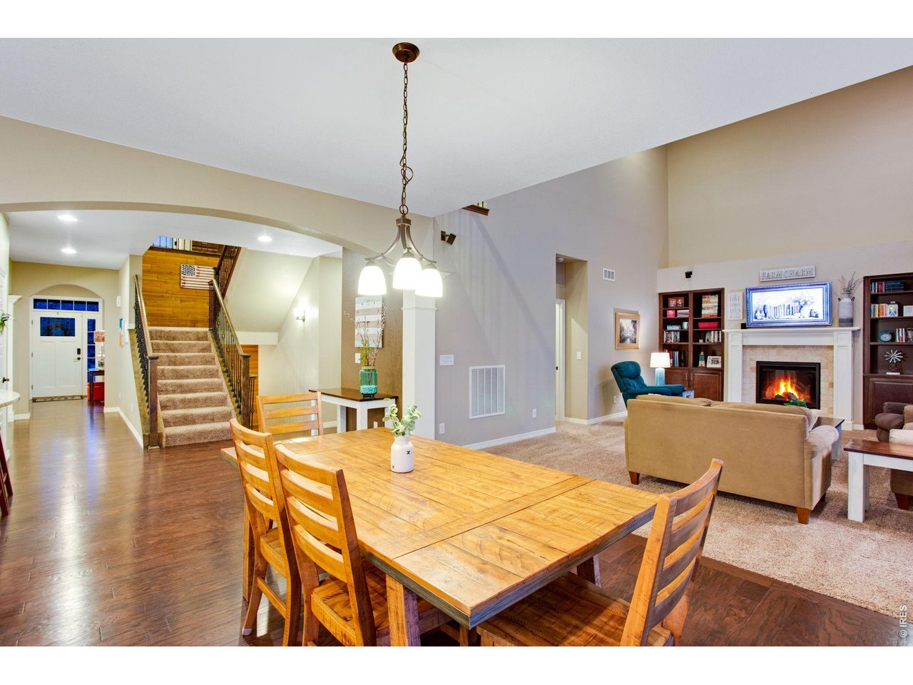 5728 Connor Street Timnath, CO 80547 - Photo 50 of 50 a dining room with furniture and wooden floor
