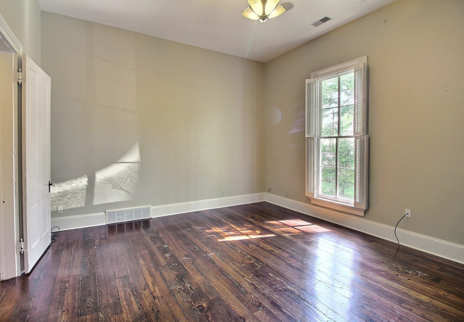 348 North Rowlett Street Collierville, TN 38017 - Photo 12 of 39 a view of empty room with a window and wooden floor