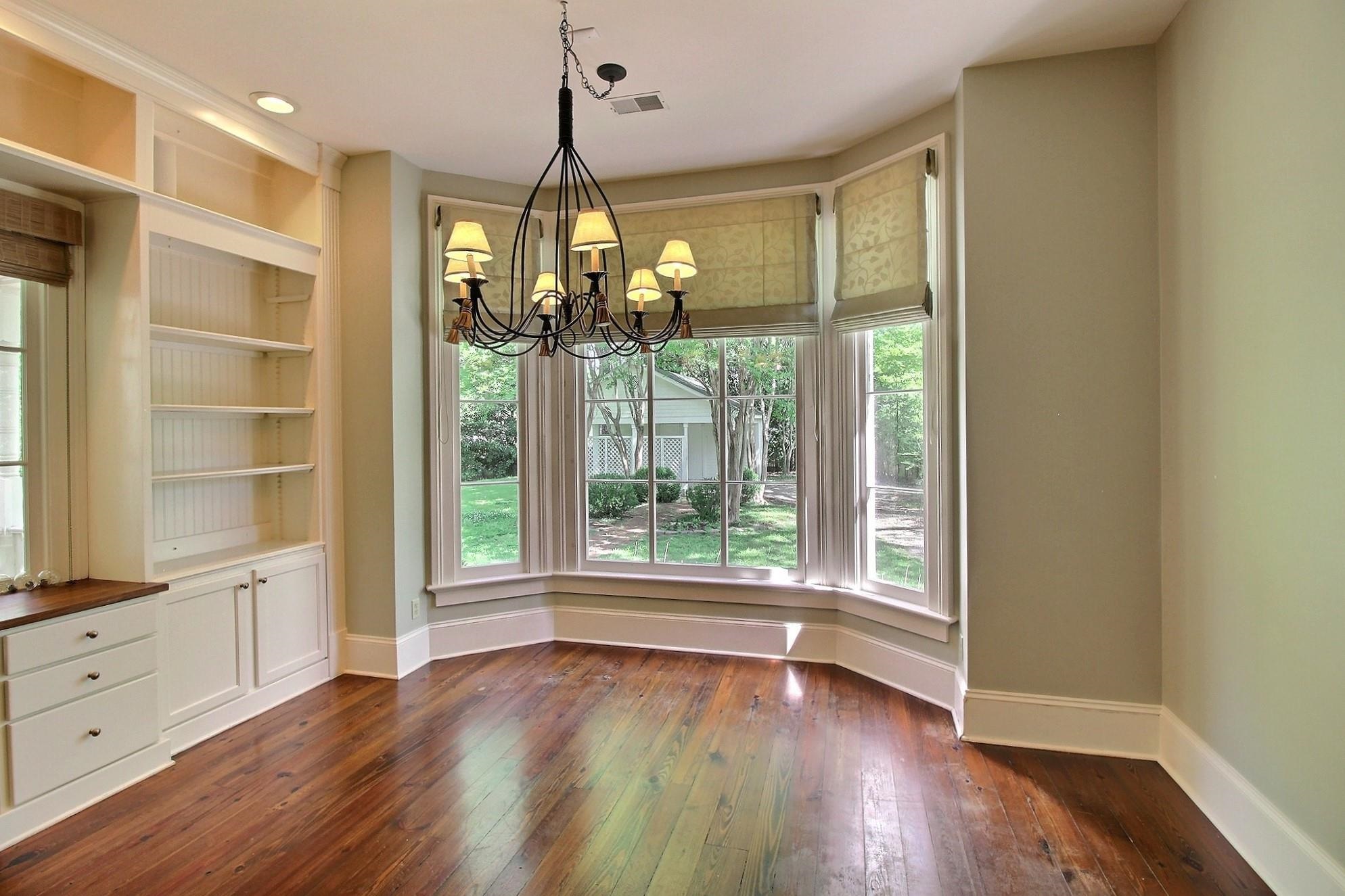 348 North Rowlett Street Collierville, TN 38017 - Photo 15 of 39 a view of a room with wooden floor closet and windows