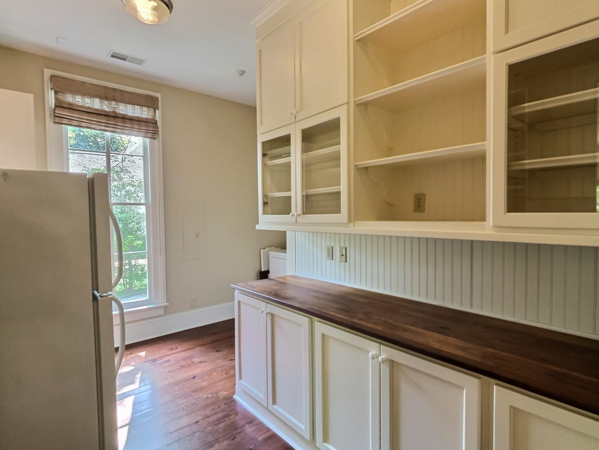 348 North Rowlett Street Collierville, TN 38017 - Photo 19 of 39 a kitchen with a sink and a refrigerator
