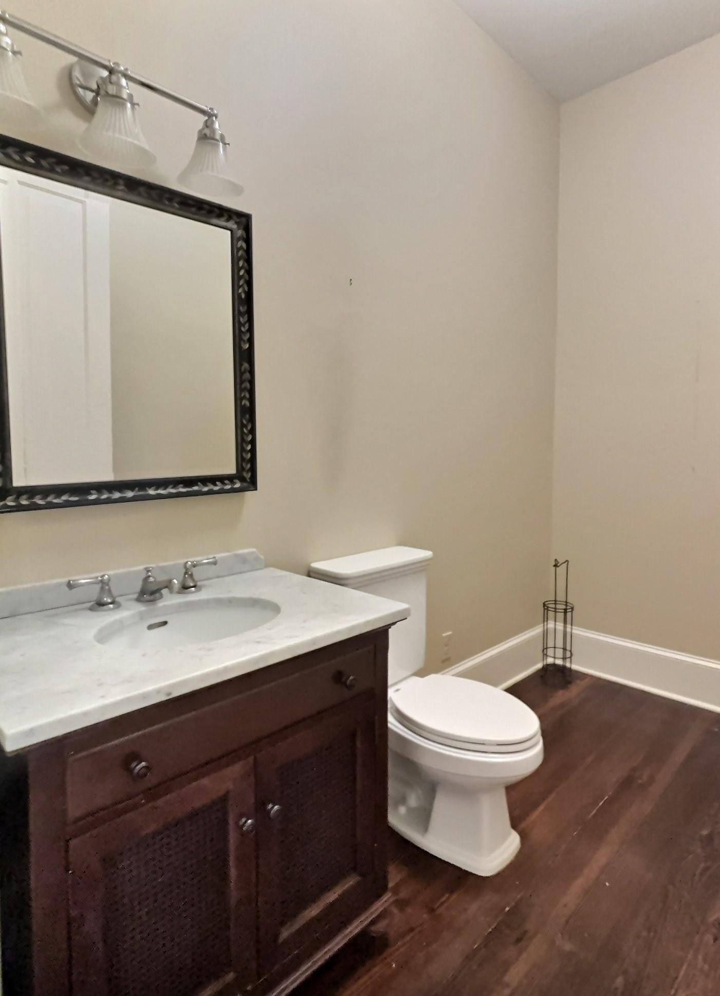 348 North Rowlett Street Collierville, TN 38017 - Photo 20 of 39 a bathroom with a granite countertop sink toilet and mirror
