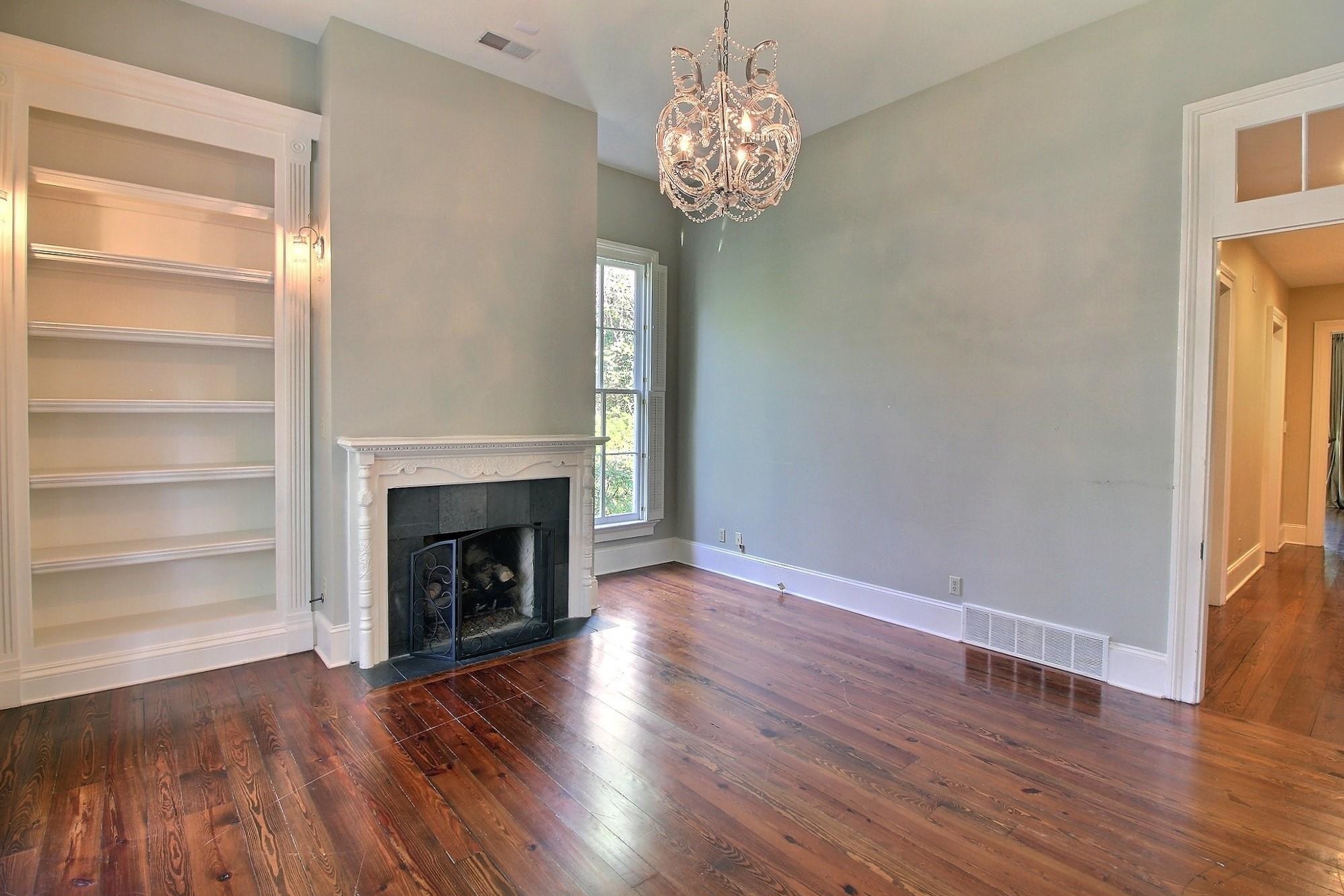 348 North Rowlett Street Collierville, TN 38017 - Photo 21 of 39 a view of a livingroom with wooden floor a fireplace and window
