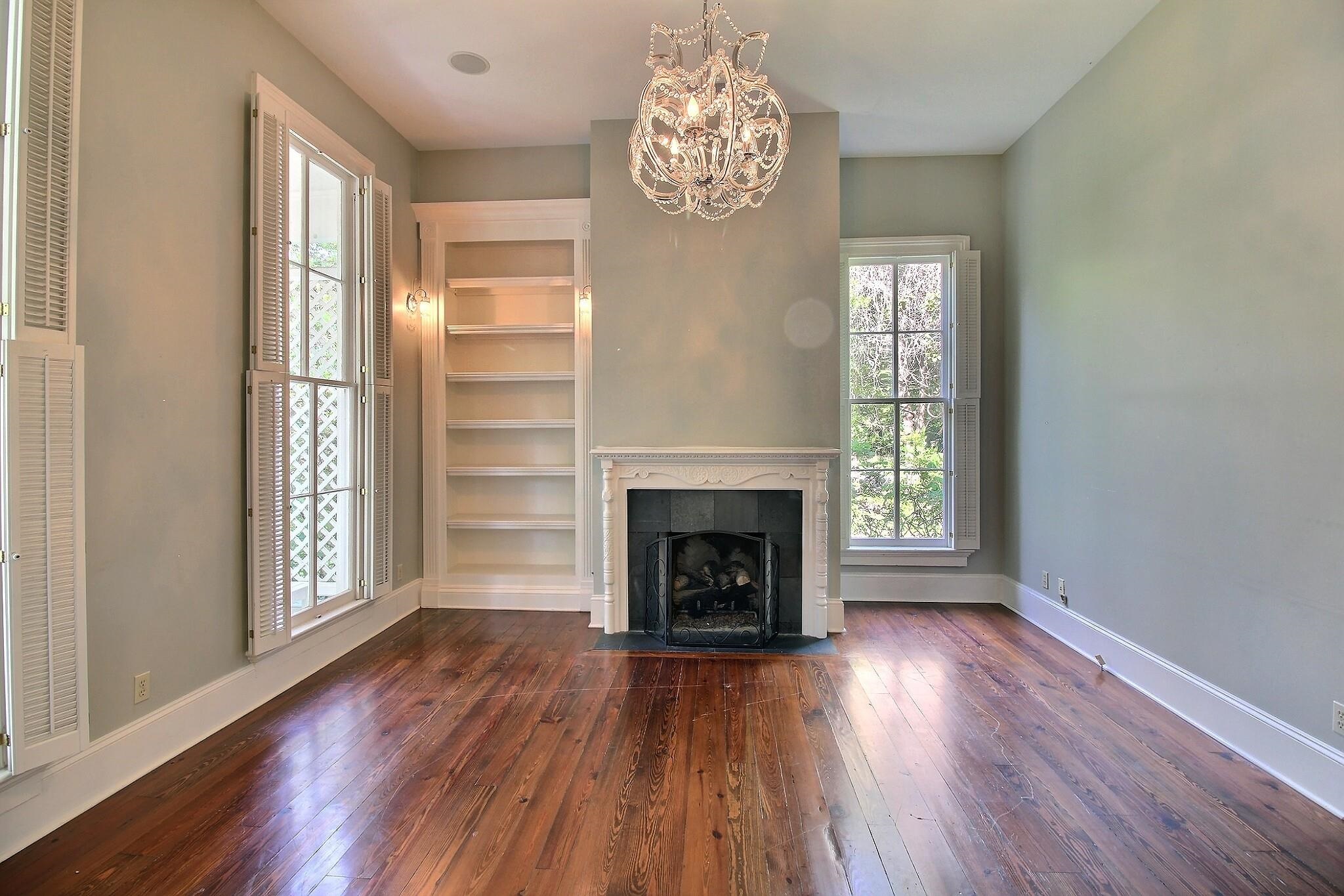348 North Rowlett Street Collierville, TN 38017 - Photo 22 of 39 a view of a livingroom with wooden floor a fireplace and windows