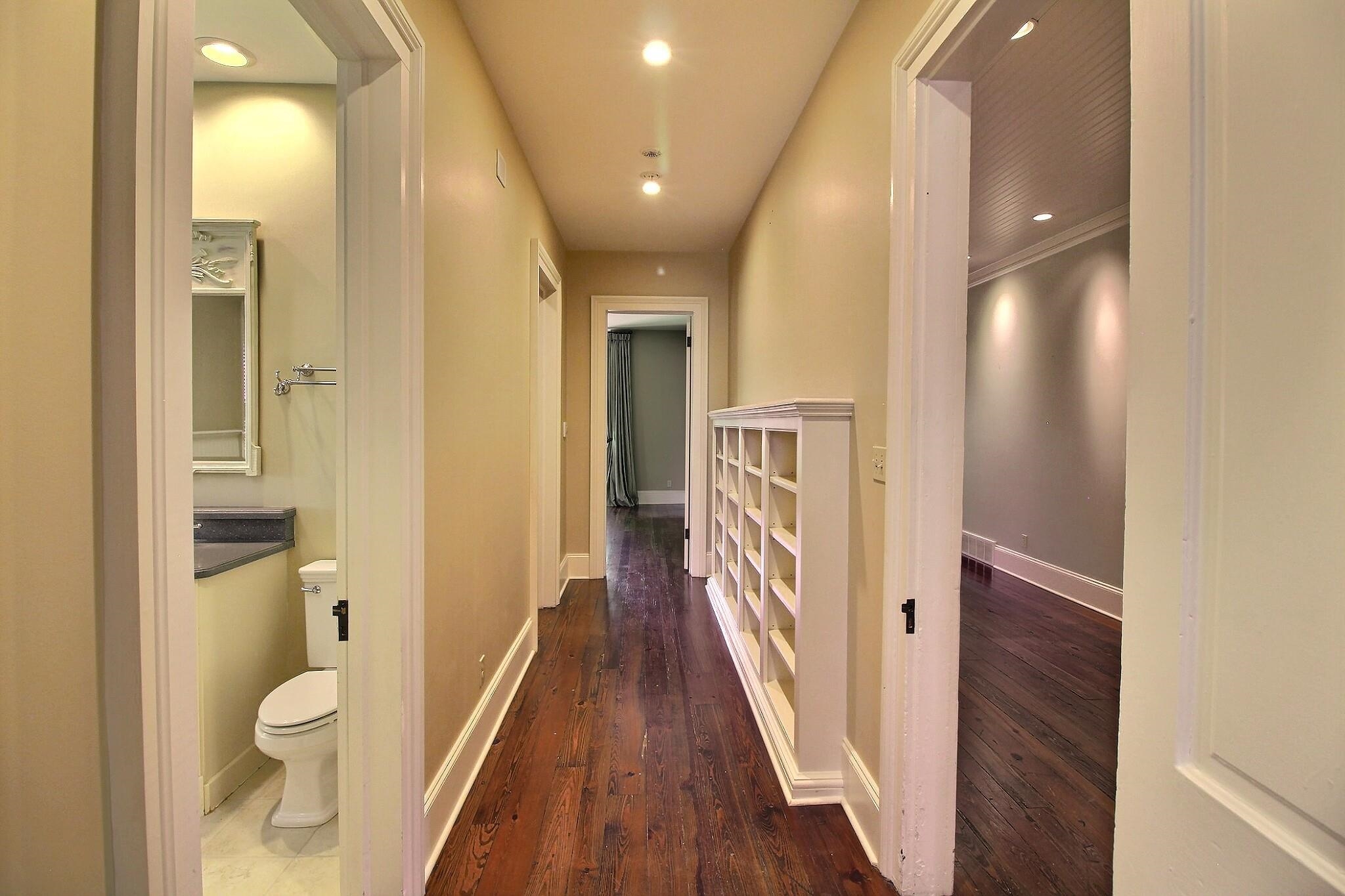 348 North Rowlett Street Collierville, TN 38017 - Photo 23 of 39 a view of a hallway with wooden floor and a bathroom