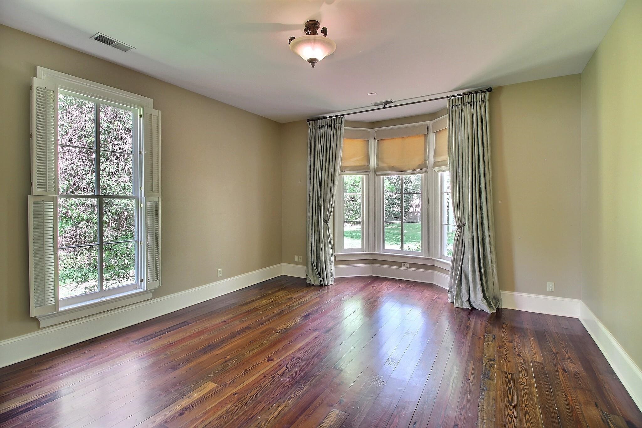 348 North Rowlett Street Collierville, TN 38017 - Photo 27 of 39 a view of an empty room with wooden floor and a window