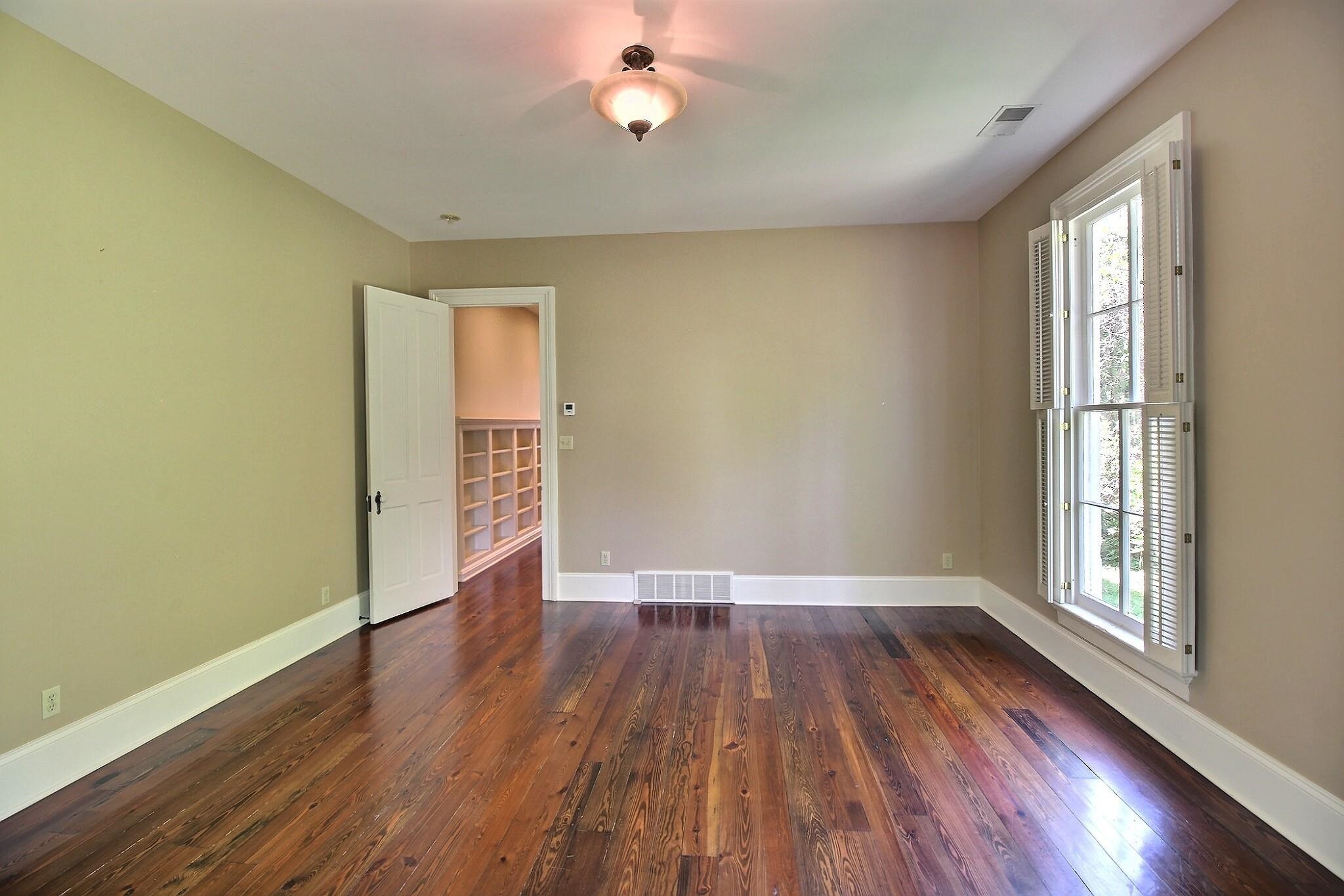 348 North Rowlett Street Collierville, TN 38017 - Photo 28 of 39 a view of an empty room with wooden floor and a window