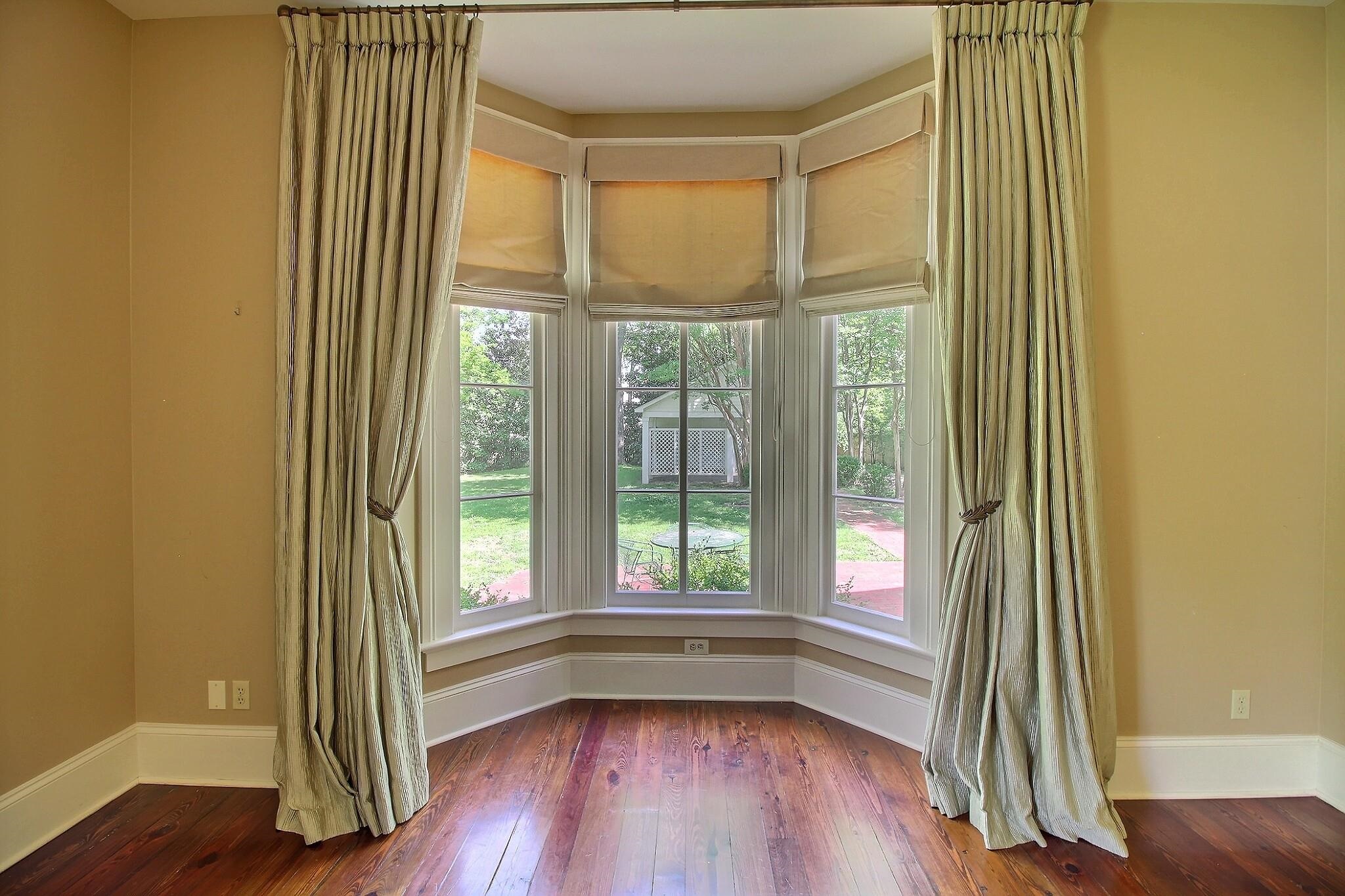 348 North Rowlett Street Collierville, TN 38017 - Photo 29 of 39 an empty room with wooden floor and windows