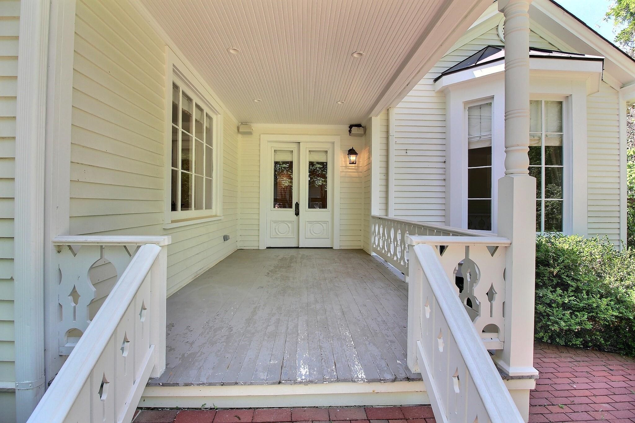 348 North Rowlett Street Collierville, TN 38017 - Photo 31 of 39 a view of balcony with wooden floor and stairs