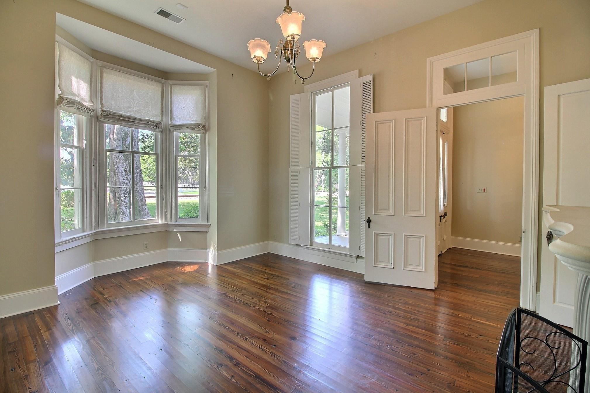 348 North Rowlett Street Collierville, TN 38017 - Photo 9 of 39 a view of an empty room with wooden floor and a window