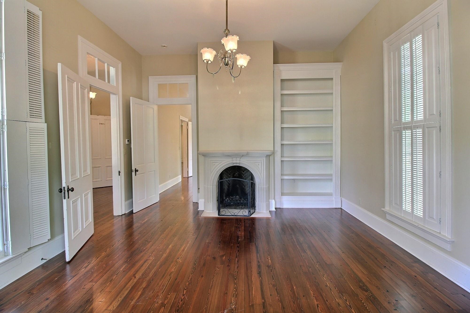 348 North Rowlett Street Collierville, TN 38017 - Photo 10 of 39 a view of a livingroom with a fireplace wooden floor and window