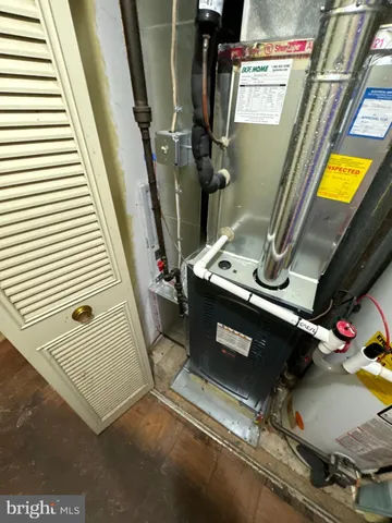 a view of gym equipment with wooden floor