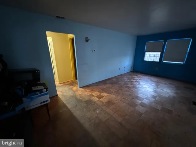 a view of an empty room with windows