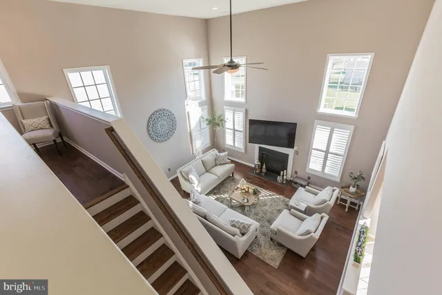 a living room with furniture fireplace and flat screen tv
