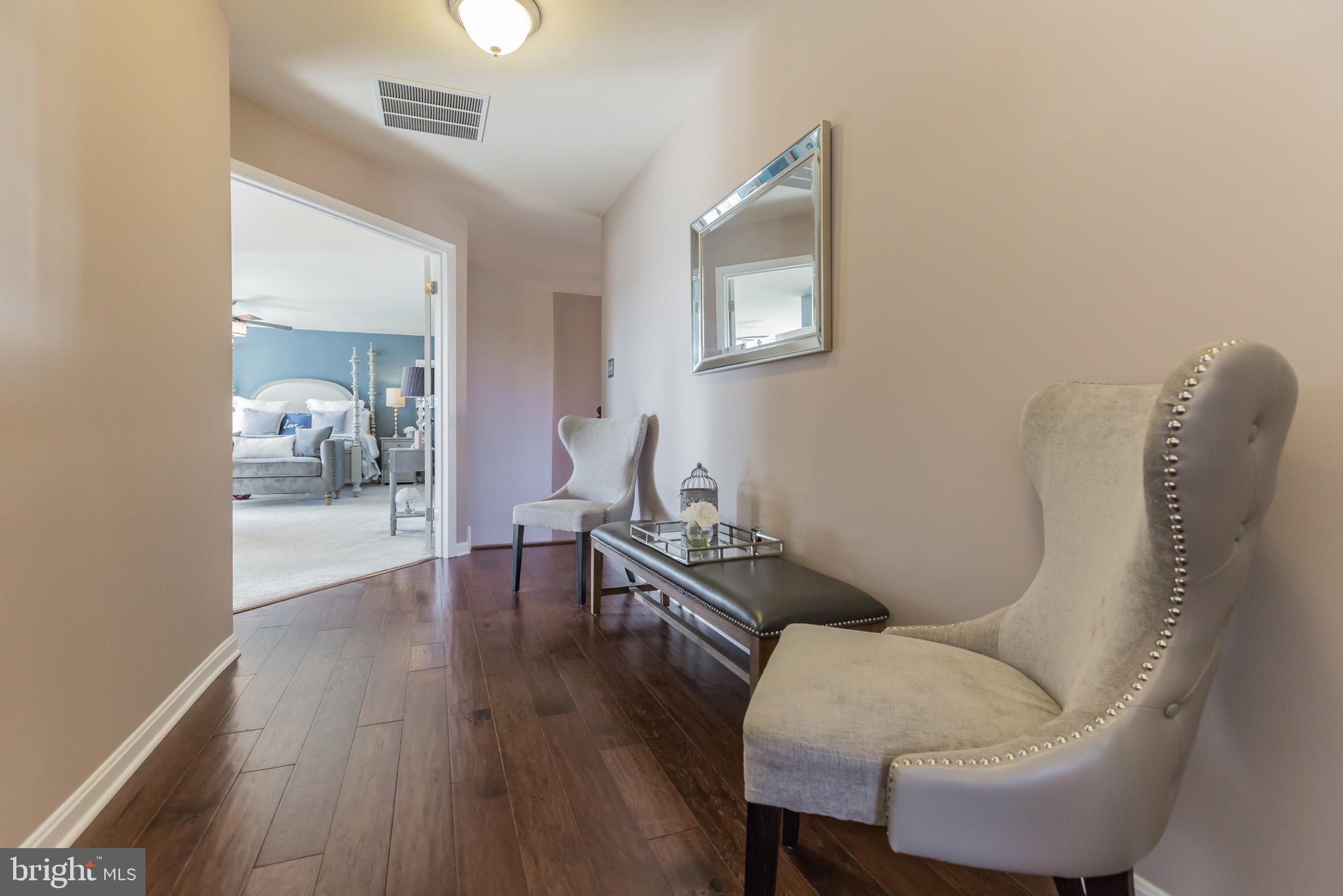 5 A Little Baltimore Road Newark, DE 19711 - Photo 12 of 27 a living room with furniture and a wooden floor