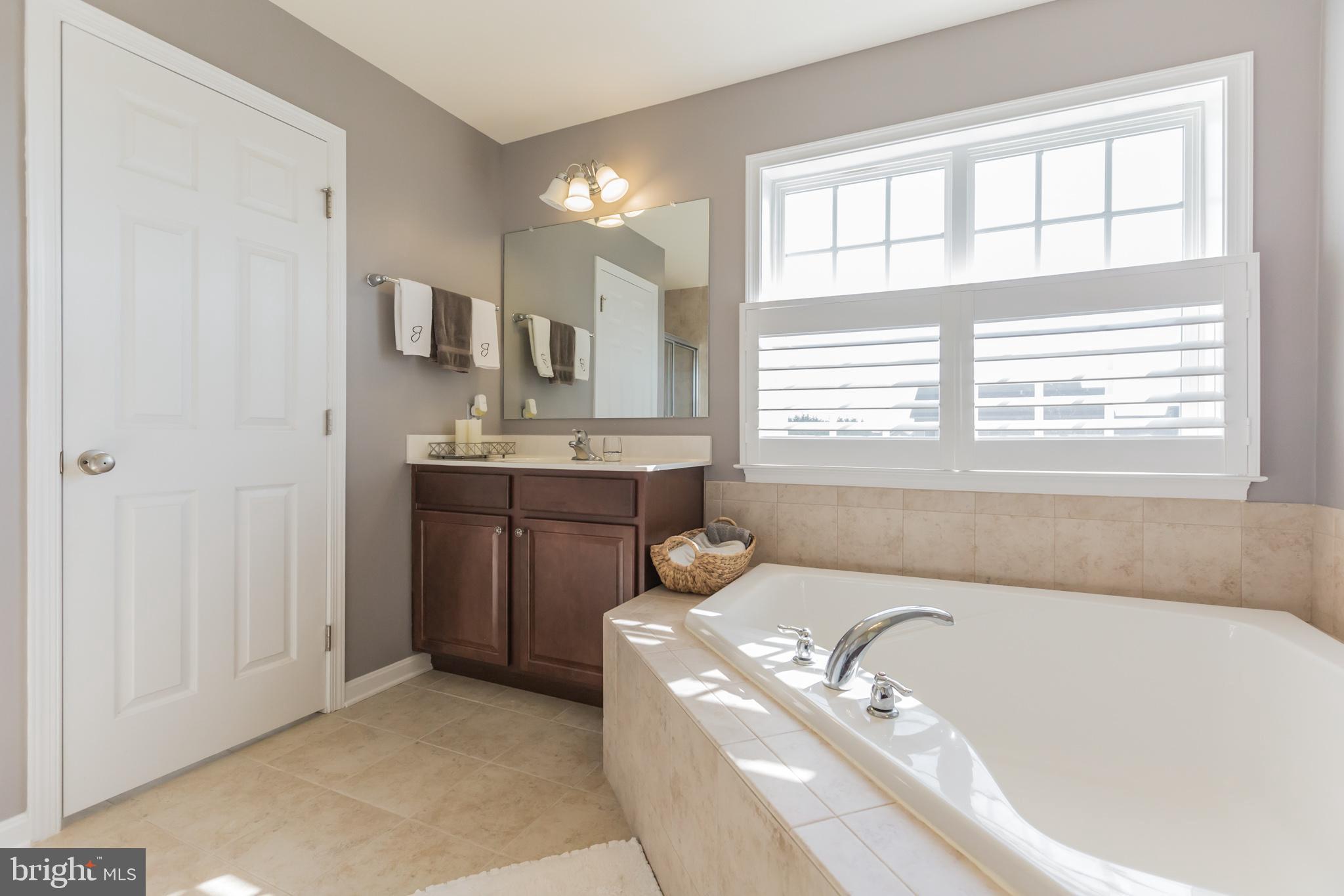 5 A Little Baltimore Road Newark, DE 19711 - Photo 20 of 27 a spacious bathroom with a tub a sink and a window