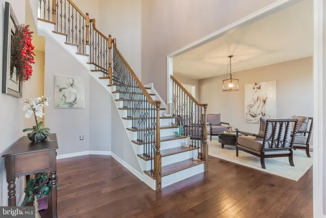 a view of entryway livingroom and hall with wooden floor