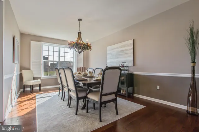 a view of a dining room with furniture and window