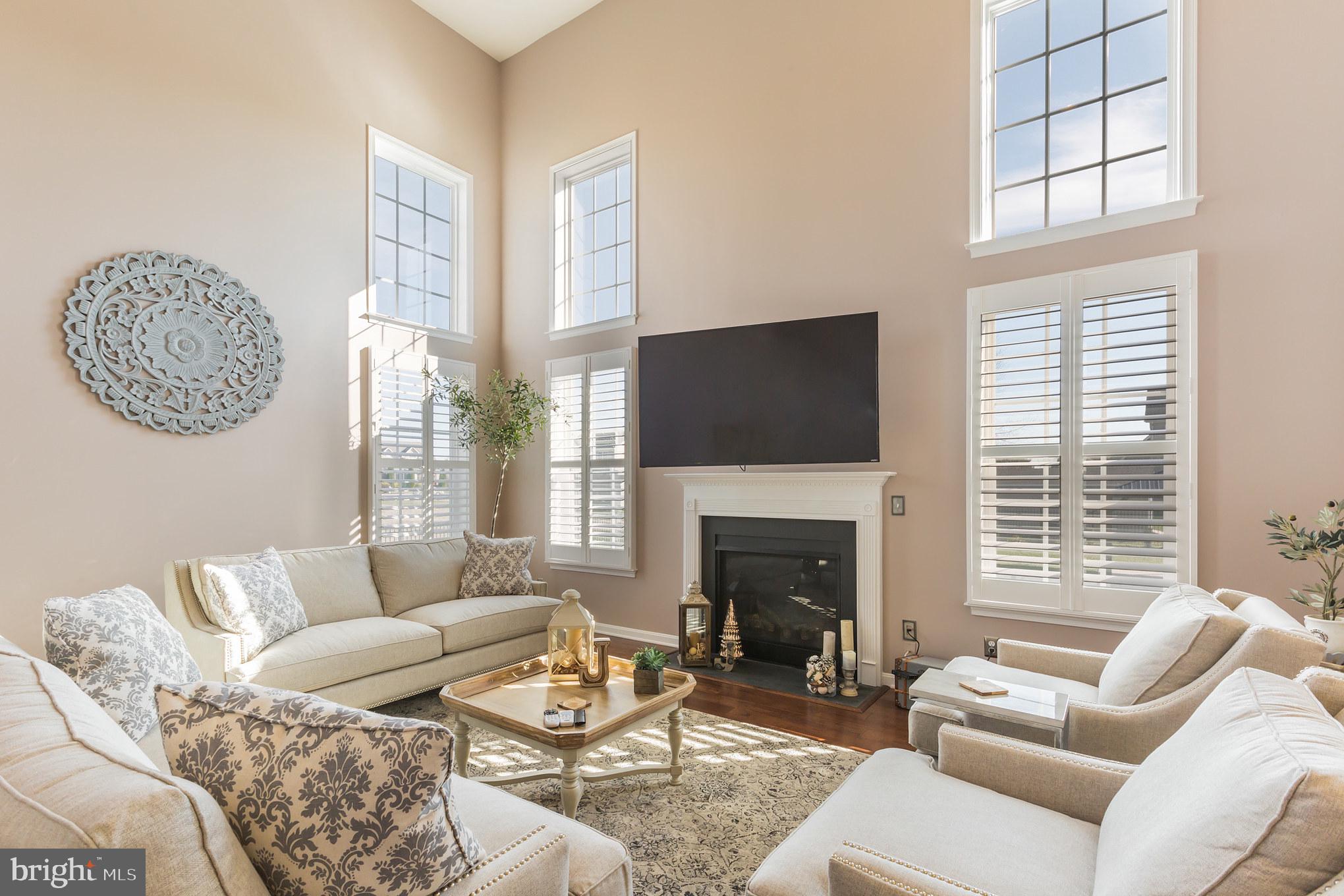 5 A Little Baltimore Road Newark, DE 19711 - Photo 10 of 27 a living room with furniture a flat screen tv and a fireplace