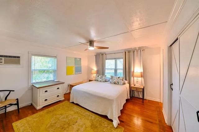 a bedroom with a bed and a window