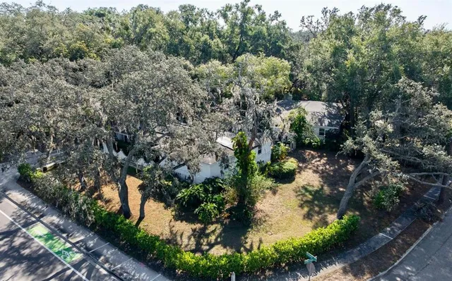 an aerial view of a houses with yard