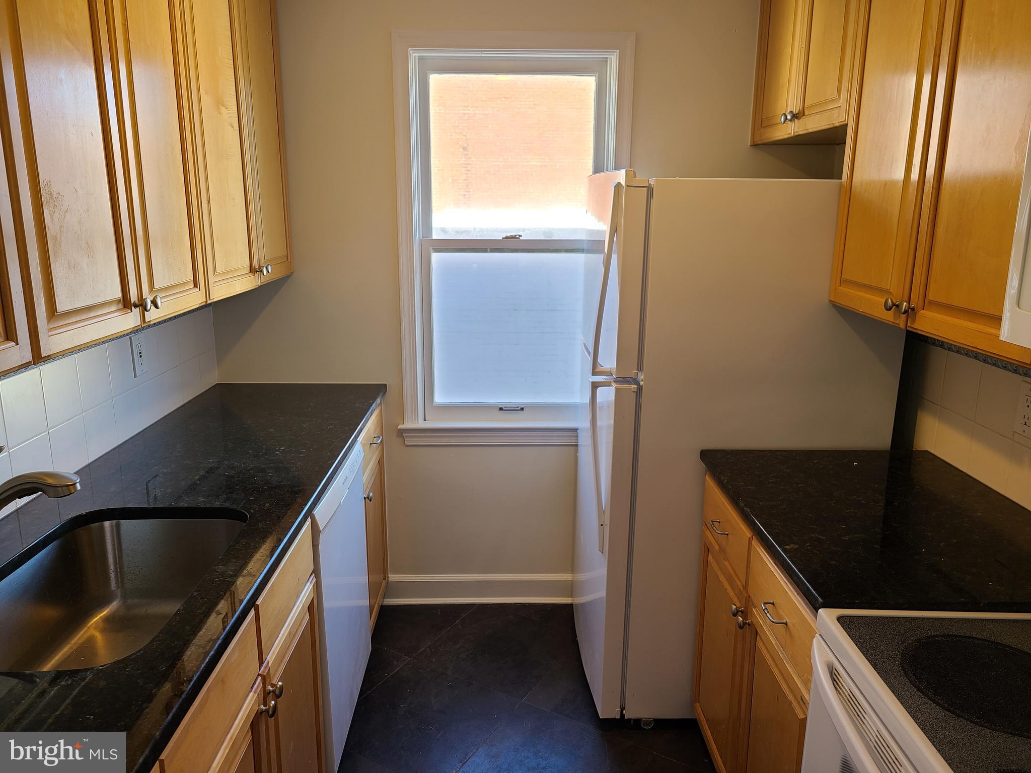 1803 T Street Northwest, Unit D Washington, DC 20009 - Photo 4 of 14 Updated kitchen with granite counters