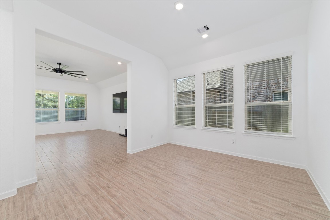 11023 Abendstern Road Tomball, TX 77375 - Photo 12 of 26 a view of an empty room with a window and wooden floor