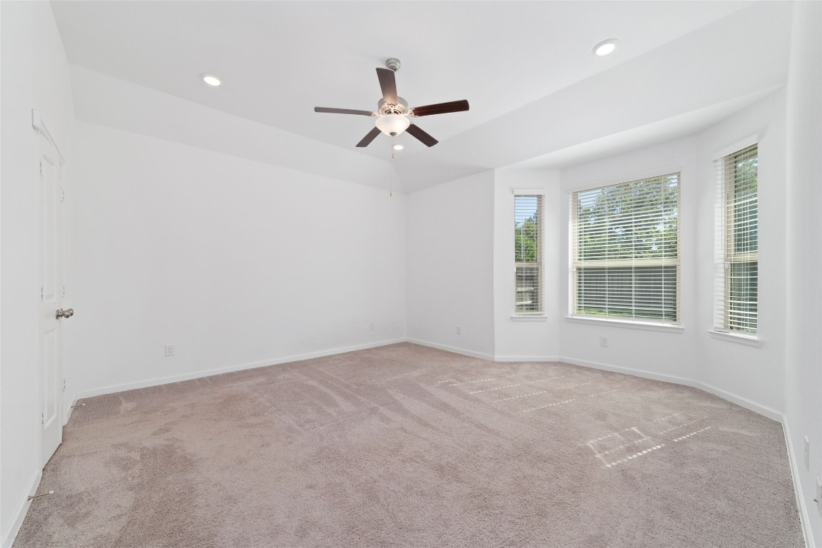 11023 Abendstern Road Tomball, TX 77375 - Photo 13 of 26 an empty room with windows and fan